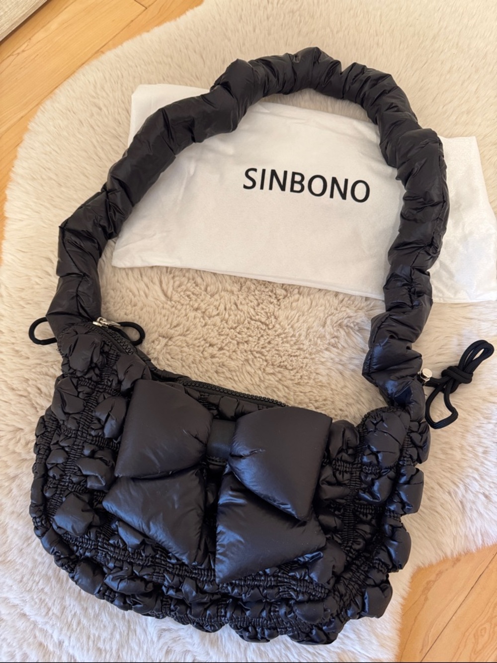 Black Quilted Shoulder Bag with Bow Accent